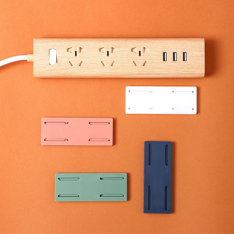 Plug-in fixer hanging wall-free punching socket plug-in row storage rack router plug-in board wall fixer