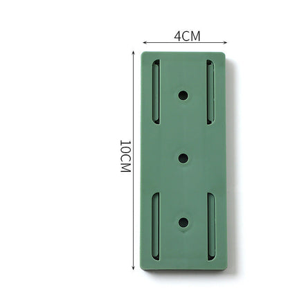 Plug-in fixer hanging wall-free punching socket plug-in row storage rack router plug-in board wall fixer